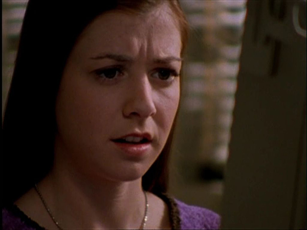 Willow looks shocked in front of a computer.