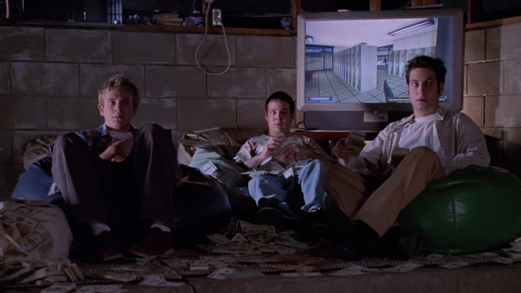 Andrew, Jonathan and Warren sitting in their basement, counting their money.