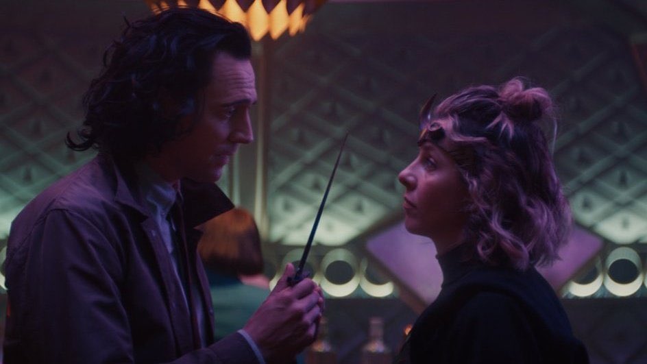 Loki holds up a dagger to Sylvie.