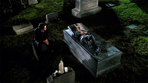 Buffy lies on a crypt talking to Holden in Conversations With Dead People.