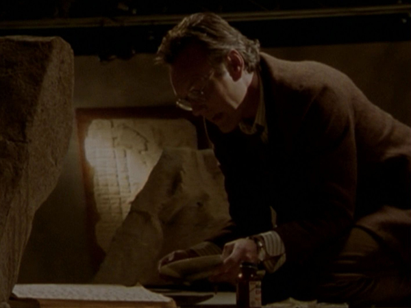 Giles tries to re-assemble the seal in the museum.
