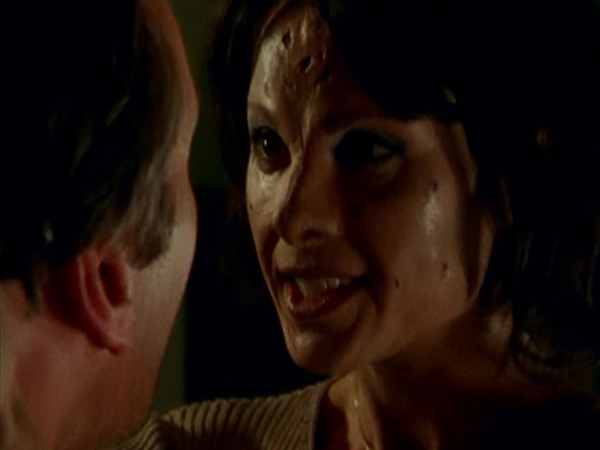 An Eyghon-possessed Jenny taunts Giles.