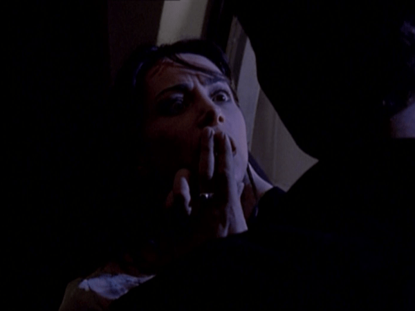 Angel presses his fingers against Jenny's lips