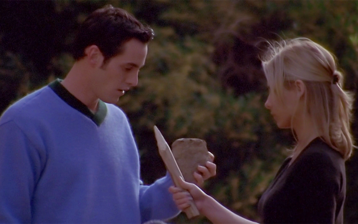 Xander and Buffy face each other, holding a rock and a wooden stake respectively