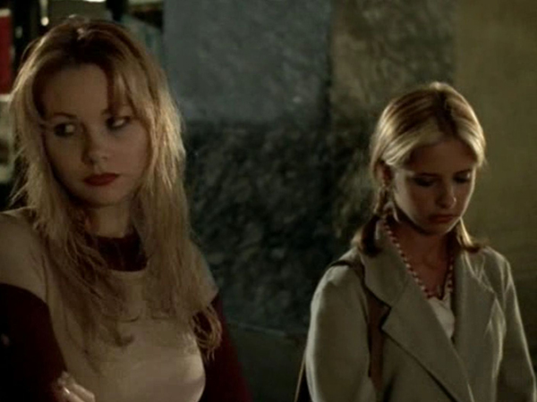 Lily and Anne walk together in melacholy silence.