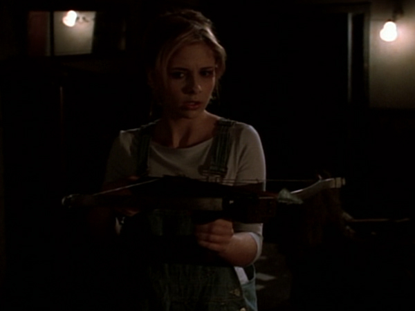 Buffy wields a crossbow in the house she expects to find Kralik in.